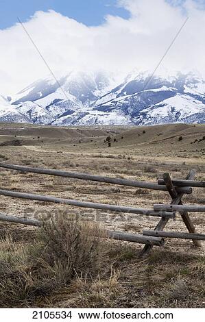 Wooden Fence In A Rural Area With Mountains Near Bozeman; Montana United States Of America View Large Photo Image Picture - Wooden Fence In A Rural Area With Mountains Near Bozeman; Montana United States Of America. Fotosearch
