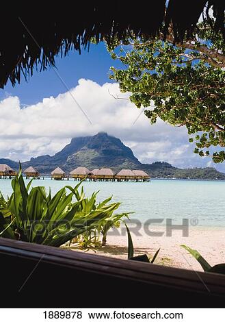 Stock Photo - Wooden Huts In Lagoon. Fotosearch