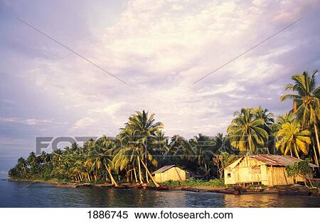 Stock Photography - Wooden Huts On Stilts By Coastland. Fotosearch