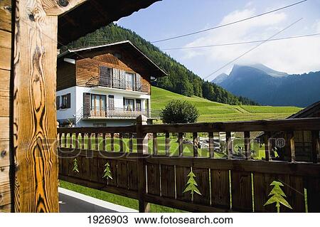 Stock Image - Wooden Lodges And Hotels. Fotosearch