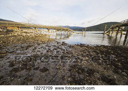 Stock Photo - Wooden piers in Burrard Inlet, North Vancouver, British Columbia, Canada. Fotosearch