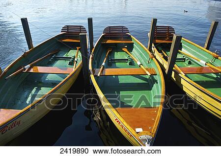 Stock Image - Wooden rowboats moored on a canal; Hamburg, Germany. Fotosearch