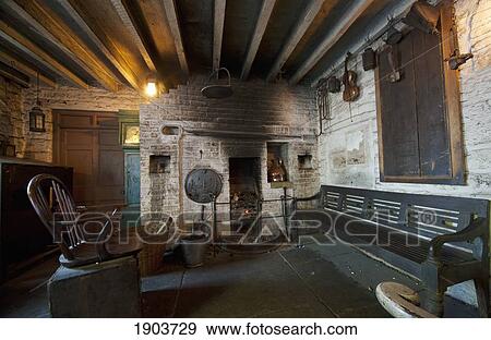 Stock Photo - Wooden Seating And A Wood Burning Fireplace; Beamish, Durham, England. Fotosearch