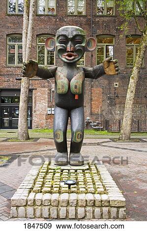 Wooden Statue In Pioneer Square; Seattle, Washington State, Usa View Large Photo Image Stock Photo - Wooden Statue In Pioneer Square; Seattle, Washington State, Usa. Fotosearch