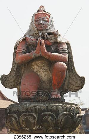 Wooden statue of Garuda on a pillar outside a temple; Bhaktapur, Nepal View Large Photo Image Stock Photo - Wooden statue of Garuda on a pillar outside a temple; Bhaktapur, Nepal. Fotosearch