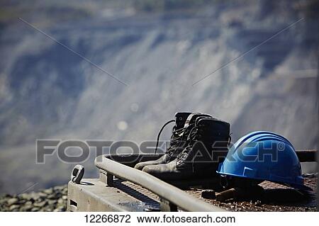 Work boots and a blue hard hat; Quebec, Canada View Large Photo Image Stock Image - Work boots and a blue hard hat; Quebec, Canada. Fotosearch