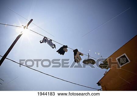 Work Gloves And Boots Hanging From The Clothesline In The Sunlight; Burano Venezia Italy View Large Photo Image Stock Image - Work Gloves And Boots Hanging From The Clothesline In The Sunlight; Burano Venezia Italy. Fotosearch