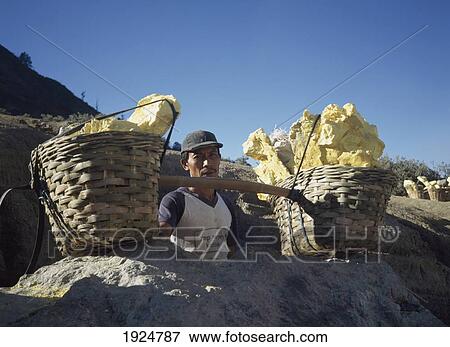 Worker With Baskets Of Yellow Sulphur View Large Photo Image Stock Photo - Worker With Baskets Of Yellow Sulphur. Fotosearch
