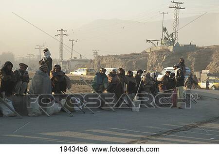 Stock Photo - Workers Wait To Get A Day Job By The Side Of A Road In Kabul First Thing In The Morning,, Afghanistan. Fotosearch