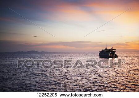 Stock Photography - World famous sites for popular dive excursions and live aboard boat trips; Similan and Surin islands, Thailand. Fotosearch