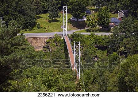 Stock Image - World's Longest Suspended Bridge 168 Feet Above The Coaticook River; Coaticook, Quebec, Canada. Fotosearch