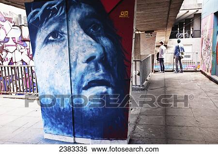 Stock Photography - World's top graffiti artists show their legally produced art work, collectively called See No Evil, on the street at Europe's biggest street art festival; Bristol, England. Fotosearch