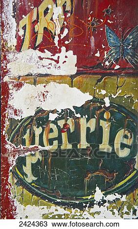 Worn and peeling signs painted on a wall; Paris, France View Large Photo Image Stock Image - Worn and peeling signs painted on a wall; Paris, France. Fotosearch