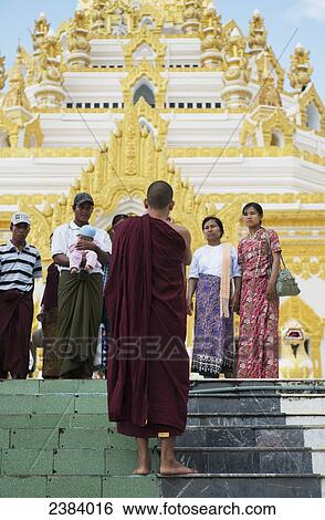 Worshippers and a monk at Shan Temple; Rangoon, Myanmar View Large Photo Image Stock Photograph - Worshippers and a monk at Shan Temple; Rangoon, Myanmar. Fotosearch