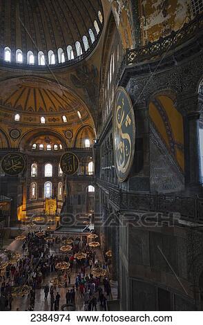 Picture - Worshippers and tourists inside an Islamic mosque; Istanbul, Turkey. Fotosearch