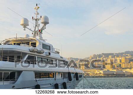 Yacht in the harbour at sunset; Genoa, Liguria, Italy View Large Photo Image Stock Photo - Yacht in the harbour at sunset; Genoa, Liguria, Italy. Fotosearch