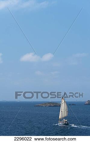 Stock Image - Yacht off coast of Ibiza; Spain. Fotosearch