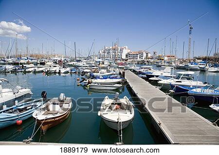 Yachts And Boats Moored In Marina Beside Pier View Large Photo Image Stock Photo - Yachts And Boats Moored In Marina Beside Pier. Fotosearch