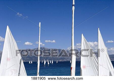 Stock Photography - Yachts Sailing Near Shore Of The Island Lefkas.. Fotosearch