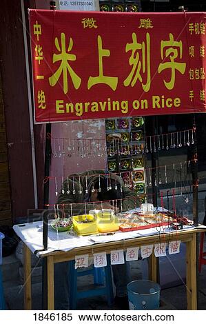 Stock Photography - Yangshuo, China; Engraving Market Stall. Fotosearch