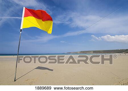 Yellow And Red Flag On The Beach At Sennen Cove View Large Photo Image Stock Photo - Yellow And Red Flag On The Beach At Sennen Cove. Fotosearch