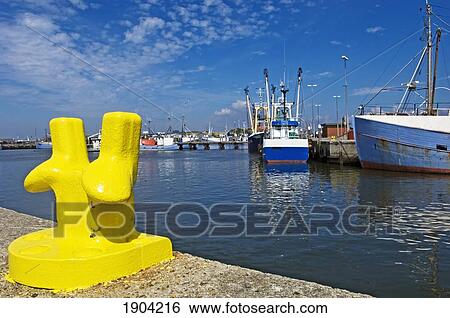 Yellow Bollard At Hvide Sande Harbour, Jutland, Denmark View Large Photo Image Stock Photograph - Yellow Bollard At Hvide Sande Harbour, Jutland, Denmark. Fotosearch
