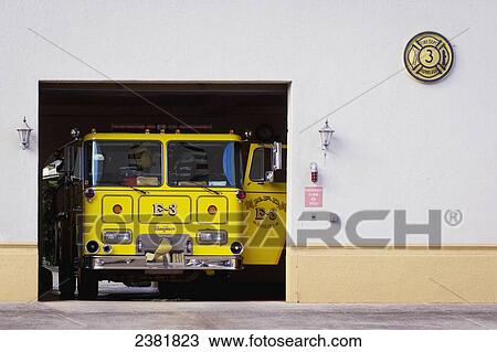 Stock Image - Yellow fire engine at the Makiki Fire Department; Honolulu, Oahu, Hawaii, United States of America. Fotosearch