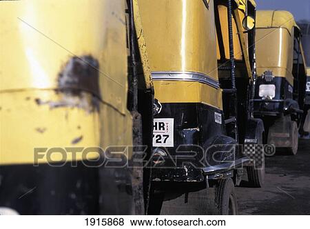 Stock Photo - Yellow Rickshaws In Row. Fotosearch