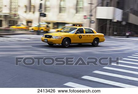 Yellow taxi speeding through New York City; New York City, New York, United States of America View Large Photo Image Stock Photograph - Yellow taxi speeding through New York City; New York City, New York, United States of America. Fotosearch