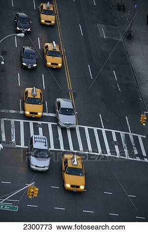 Yellow Taxis and other traffic on 23rd and 8th, Manhattan; New York City, New York, United States of America View Large Photo Image Stock Image - Yellow Taxis and other traffic on 23rd and 8th, Manhattan; New York City, New York, United States of America. Fotosearch