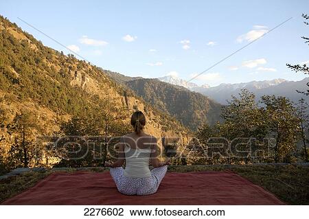 Stock Image - Yoga at 360 Degrees Leti Hotel; Uttaranchal, India. Fotosearch