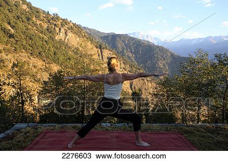 Stock Image - Yoga at 360 Degrees Leti Hotel; Uttaranchal, India. Fotosearch