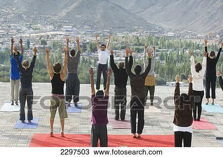Yoga 'salutation to the sun' performed in front of the Shanti (Peace) Stupa overlooking Leh. Ladakh, Province of Jammu and Kashmir, India View Large Photo Image Stock Image - Yoga 'salutation to the sun' performed in front of the Shanti (Peace) Stupa overlooking Leh. Ladakh, Province of Jammu and Kashmir, India. Fotosearch