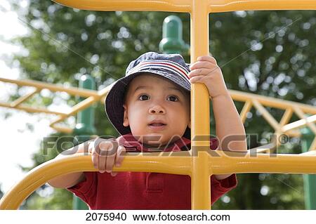 Young Asian-Caucasian Boy Climbing Playground Equipment; Ontario Canada View Large Photo Image Stock Image - Young Asian-Caucasian Boy Climbing Playground Equipment; Ontario Canada. Fotosearch