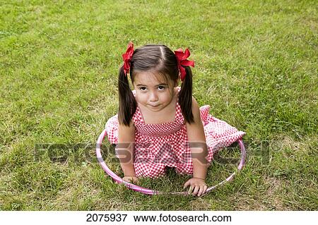 Young Asian-Caucasian Girl Disappointed That Her Hula Hoop Fell; Ontario Canada View Large Photo Image Stock Photo - Young Asian-Caucasian Girl Disappointed That Her Hula Hoop Fell; Ontario Canada. Fotosearch