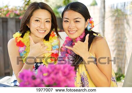 Young Asian Girls Celebrate A Great Vacation Together. View Large Photo Image Stock Photo - Young Asian Girls Celebrate A Great Vacation Together.. Fotosearch