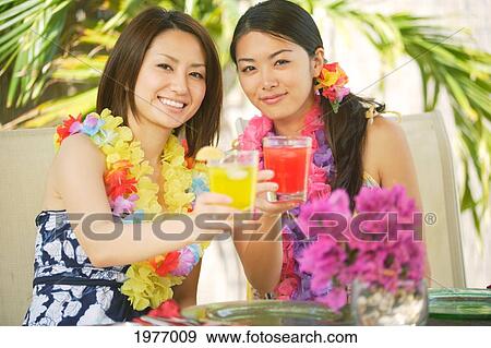 Young Asian Girls Celebrate A Great Vacation Together. View Large Photo Image Stock Photo - Young Asian Girls Celebrate A Great Vacation Together.. Fotosearch