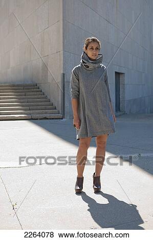 Young Attractive Iranian Woman Wearing Stylish Clothing Against A Concrete Wall; Winnipeg Manitoba Canada View Large Photo Image Stock Photo - Young Attractive Iranian Woman Wearing Stylish Clothing Against A Concrete Wall; Winnipeg Manitoba Canada. Fotosearch