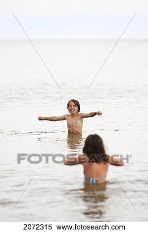 Young Boy And Girl Swimming In Chilly Lake Winnipeg, Gimli, Manitoba, Canada View Large Photo Image Stock Photography - Young Boy And Girl Swimming In Chilly Lake Winnipeg, Gimli, Manitoba, Canada. Fotosearch