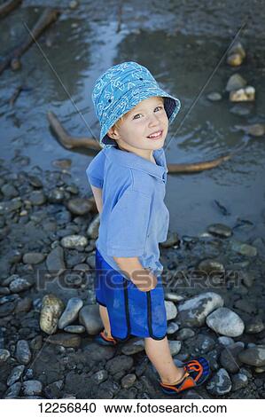 Stock Image - Young boy at the Peg Leg Bar; Chilliwack, British Columbia, Canada. Fotosearch
