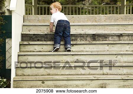 Young Boy Climbing Stairs; Ontario Canada View Large Photo Image Stock Photo - Young Boy Climbing Stairs; Ontario Canada. Fotosearch