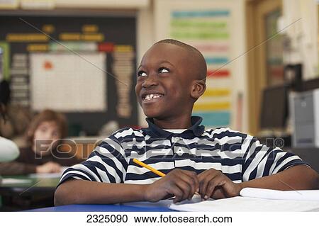 Young Boy In Grade 3 Working At His Desk In Classroom, Toronto, Ontario, Canada View Large Photo Image Stock Image - Young Boy In Grade 3 Working At His Desk In Classroom, Toronto, Ontario, Canada. Fotosearch