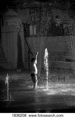 Young Boy Playing In Fountain Spray View Large Photo Image Stock Photo - Young Boy Playing In Fountain Spray. Fotosearch