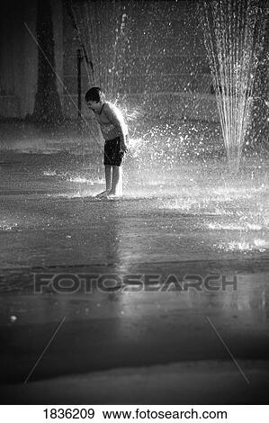Young Boy Playing In Fountain Spray View Large Photo Image Stock Photo - Young Boy Playing In Fountain Spray. Fotosearch