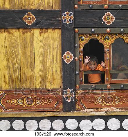 Young Boy Waving At Window Of Rinpung Dzong Monastery; Paro District Bhutan View Large Photo Image Stock Photograph - Young Boy Waving At Window Of Rinpung Dzong Monastery; Paro District Bhutan. Fotosearch