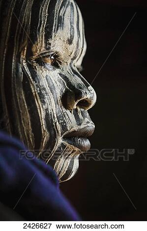 Young boy with traditional painted face, paint made from natural ground river stones, Omo region, Southwest Ethiopia; Kibish, Ethiopia View Large Photo Image Stock Photo - Young boy with traditional painted face, paint made from natural ground river stones, Omo region, Southwest Ethiopia; Kibish, Ethiopia. Fotosearch