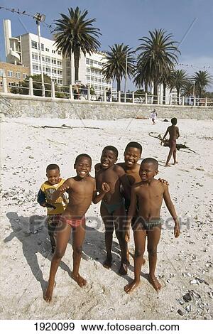 Stock Photo - Young Boys Playing In City Beach. Fotosearch