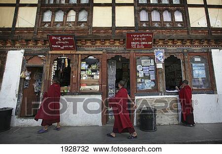 Stock Image - Young Buddhist Monks Shopping. Fotosearch