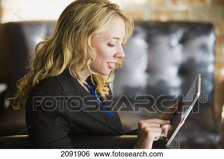 Young Businesswoman Using A Tablet; Bradford Ontario Canada View Large Photo Image Stock Photograph - Young Businesswoman Using A Tablet; Bradford Ontario Canada. Fotosearch