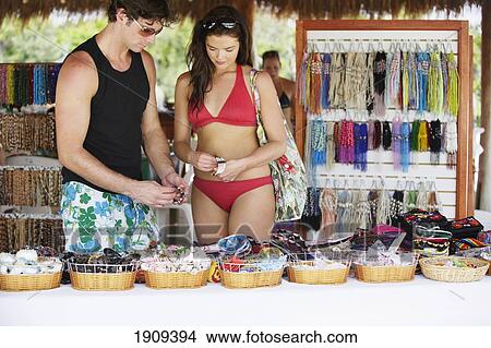 Young Couple Shopping At Market Stall, Mayan Riviera, Yucatan Peninsular, Quintana Roo State, Mexico View Large Photo Image Picture - Young Couple Shopping At Market Stall, Mayan Riviera, Yucatan Peninsular, Quintana Roo State, Mexico. Fotosearch